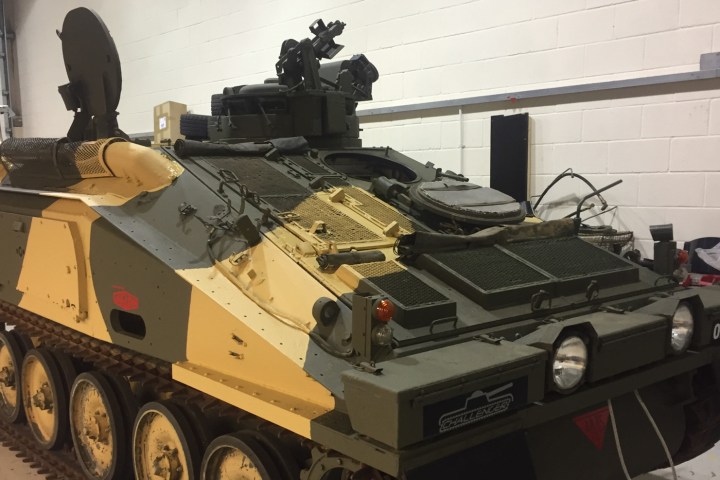 a truck cake sitting on top of a vehicle