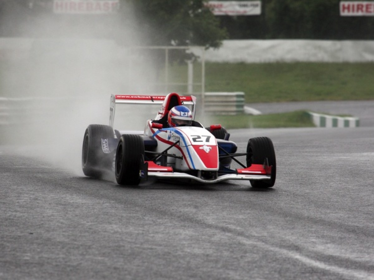a person riding a motorcycle down the road